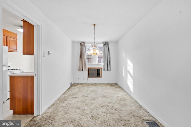6344 Glenloch St, Philadelphia, PA 19135 - unfurnished dining area featuring a chandelier, light carpet, and heating unit