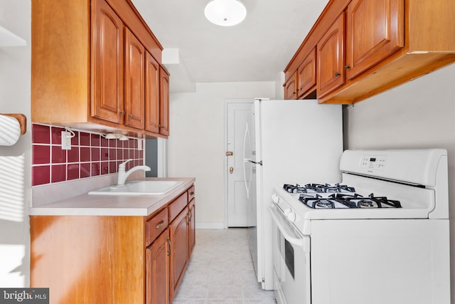 6344 Glenloch St, Philadelphia, PA 19135 - kitchen featuring white gas range oven, tasteful backsplash, light countertops, and brown cabinets