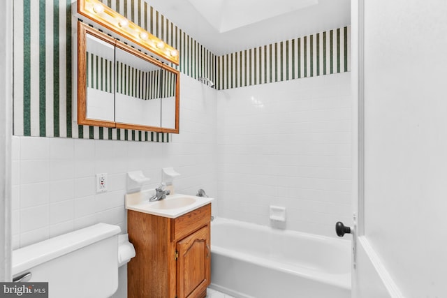 6344 Glenloch St, Philadelphia, PA 19135 - bathroom featuring wallpapered walls, vanity, shower / tub combination, and tile walls