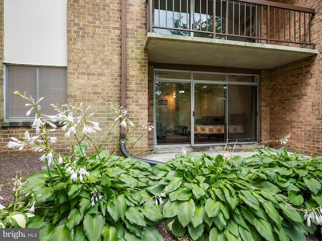 18615 Walkers Choice Rd # 2, Gaithersburg, MD 20886 - view of exterior entry featuring a balcony and brick siding