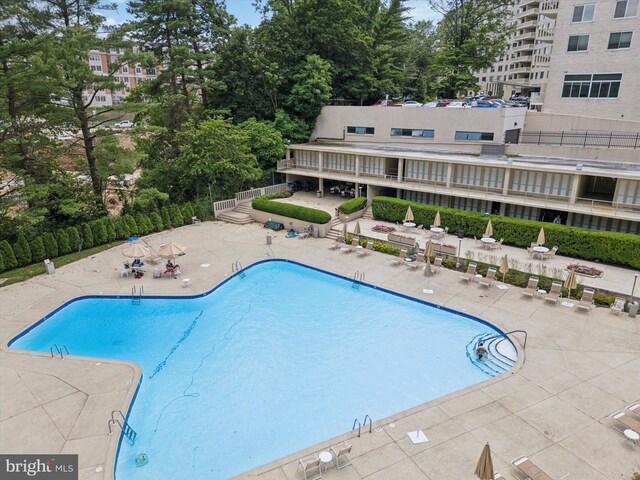 191 Presidential Blvd Unit R-605, Bala Cynwyd, PA 19004 - community pool featuring a patio area and view of scattered trees