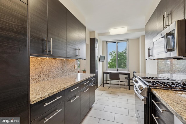 191 Presidential Blvd Unit R-605, Bala Cynwyd, PA 19004 - kitchen featuring stainless steel appliances, light tile patterned flooring, tasteful backsplash, and modern cabinets