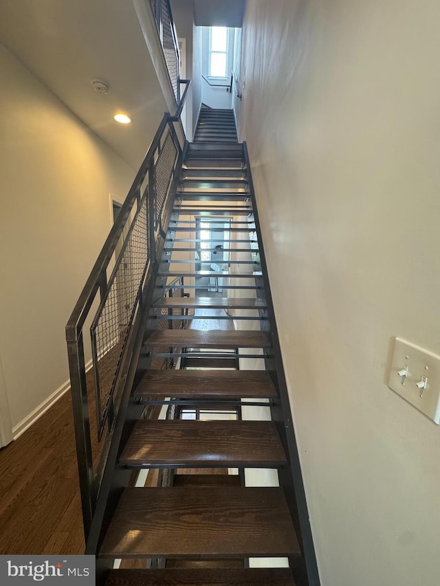 2208 Amber St, Philadelphia, PA 19125 - stairway featuring a high ceiling and wood finished floors