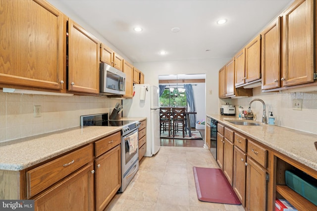 500 Lynetree Dr Unit 1-C, West Chester, PA 19380 - kitchen with appliances with stainless steel finishes, tasteful backsplash, recessed lighting, and light stone counters