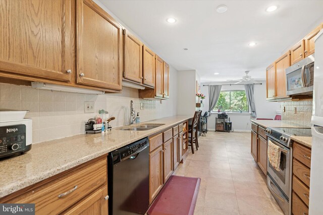 500 Lynetree Dr Unit 1-C, West Chester, PA 19380 - kitchen with appliances with stainless steel finishes, ceiling fan, recessed lighting, tasteful backsplash, and light tile patterned flooring