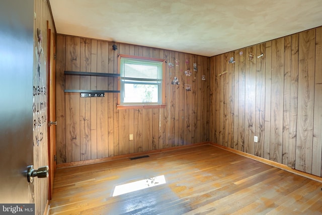 101 Walton Ave, Carlisle, PA 17013 - unfurnished room featuring wood finished floors and wood walls