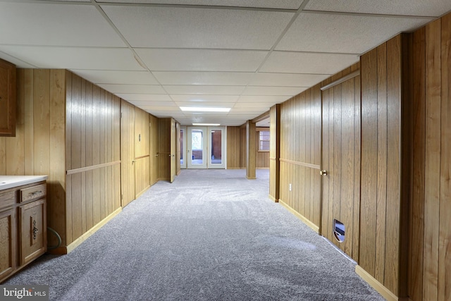 101 Walton Ave, Carlisle, PA 17013 - corridor with light carpet, wood walls, and a drop ceiling