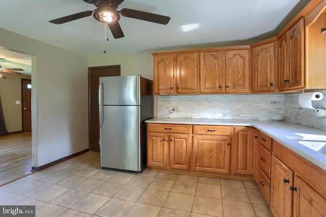 101 Walton Ave, Carlisle, PA 17013 - kitchen with freestanding refrigerator, ceiling fan, backsplash, and light countertops