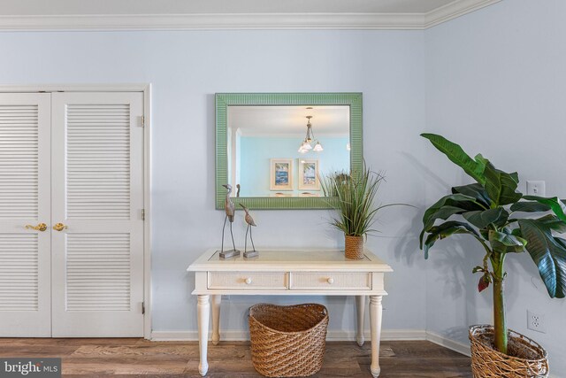 37 Fountain Dr W Unit 4C, Ocean City, MD 21842 - detailed view of crown molding, wood finished floors, and a chandelier