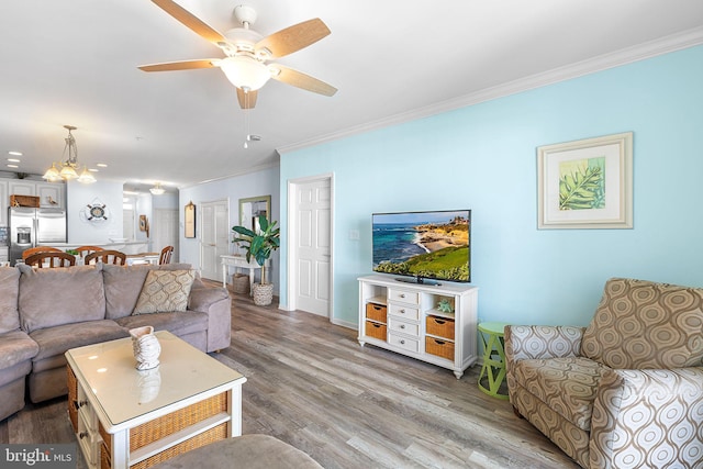 37 Fountain Dr W Unit 4C, Ocean City, MD 21842 - living area with crown molding, wood finished floors, and a ceiling fan