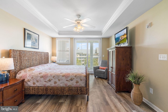 37 Fountain Dr W Unit 4C, Ocean City, MD 21842 - bedroom with a tray ceiling, wood finished floors, access to outside, ceiling fan, and ornamental molding