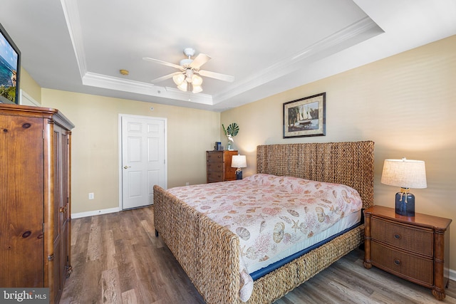 37 Fountain Dr W Unit 4C, Ocean City, MD 21842 - bedroom featuring a raised ceiling, wood finished floors, crown molding, and a ceiling fan