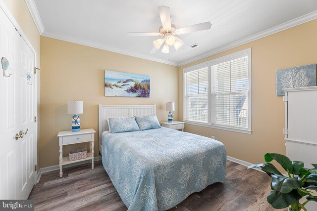 37 Fountain Dr W Unit 4C, Ocean City, MD 21842 - bedroom featuring wood finished floors, ornamental molding, a ceiling fan, and a closet