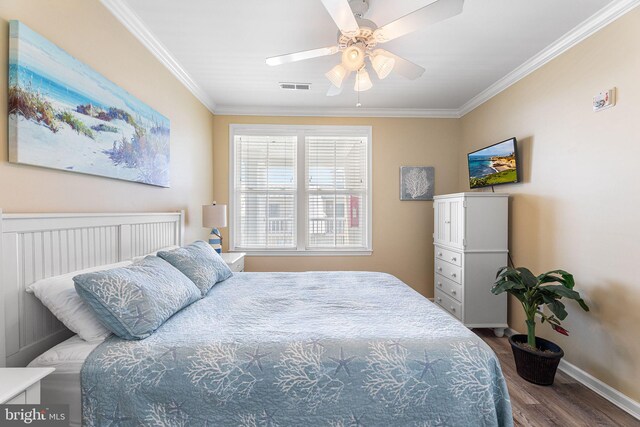 37 Fountain Dr W Unit 4C, Ocean City, MD 21842 - bedroom featuring wood finished floors, ornamental molding, and a ceiling fan