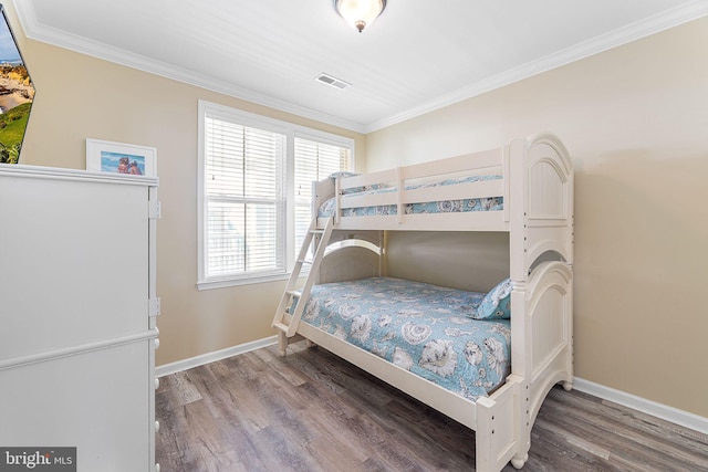 37 Fountain Dr W Unit 4C, Ocean City, MD 21842 - bedroom featuring wood finished floors, crown molding, and multiple windows