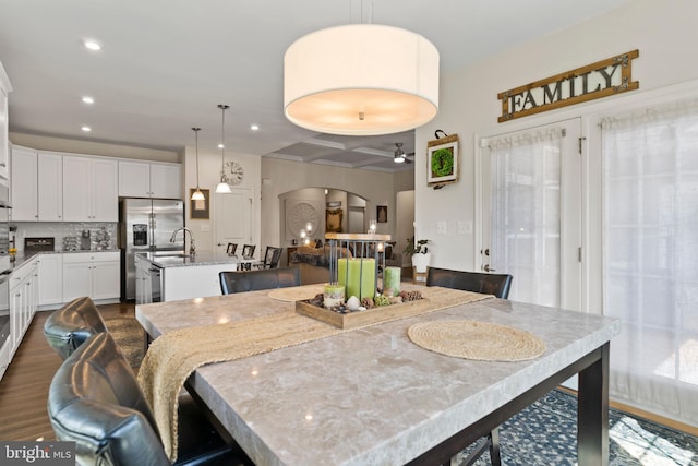 3404 Citation Dr, Harrisburg, PA 17112 - dining area with arched walkways, coffered ceiling, recessed lighting, a ceiling fan, and dark wood-style floors
