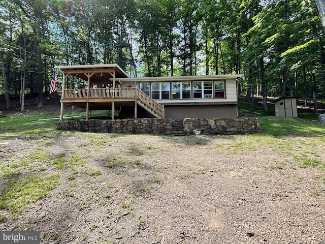 4677 Back Hollow Rd, Blain, PA 17006 - view of front of property with a storage shed, a wooden deck, stairs, and view of wooded area