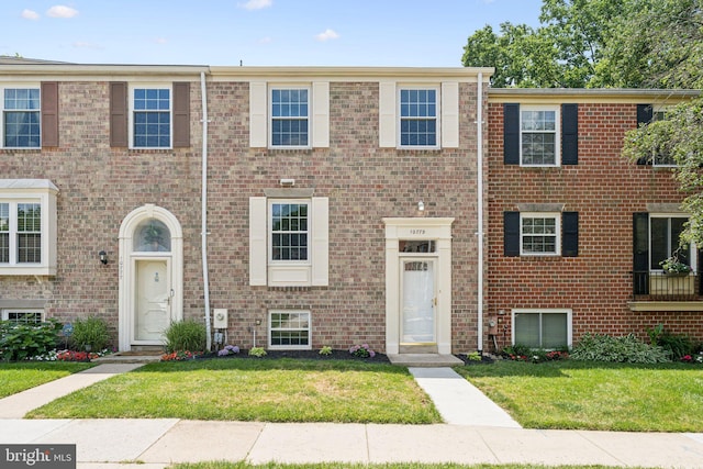 10779 Cordage Walk, Columbia, MD 21044 - townhome / multi-family property featuring a front lawn and brick siding
