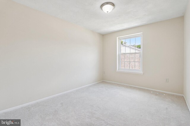 10779 Cordage Walk, Columbia, MD 21044 - carpeted spare room with baseboards and a textured ceiling