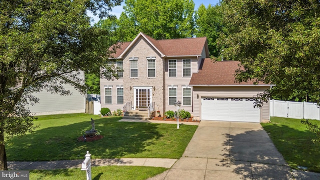 8910 Edison Ln, Clinton, MD 20735 - colonial-style house featuring concrete driveway, a garage, a shingled roof, and a gate