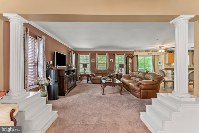 8910 Edison Ln, Clinton, MD 20735 - living room featuring ornate columns, light colored carpet, crown molding, and a ceiling fan