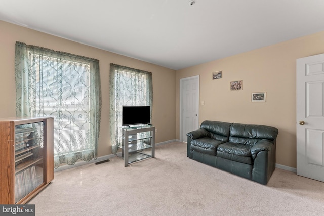 8910 Edison Ln, Clinton, MD 20735 - carpeted living area featuring healthy amount of natural light