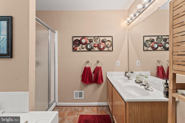 8910 Edison Ln, Clinton, MD 20735 - bathroom featuring double vanity and a shower stall