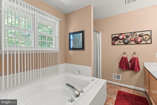 8910 Edison Ln, Clinton, MD 20735 - bathroom featuring vanity, a bath, and a shower stall