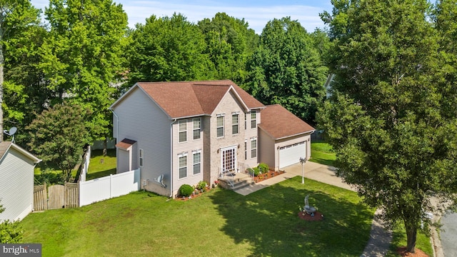8910 Edison Ln, Clinton, MD 20735 - view of front of home with concrete driveway, an attached garage, and a gate