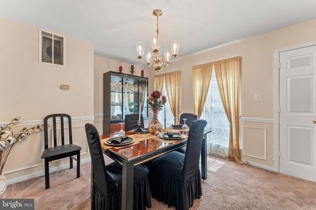 8910 Edison Ln, Clinton, MD 20735 - dining area with light carpet, a chandelier, plenty of natural light, wainscoting, and a desk
