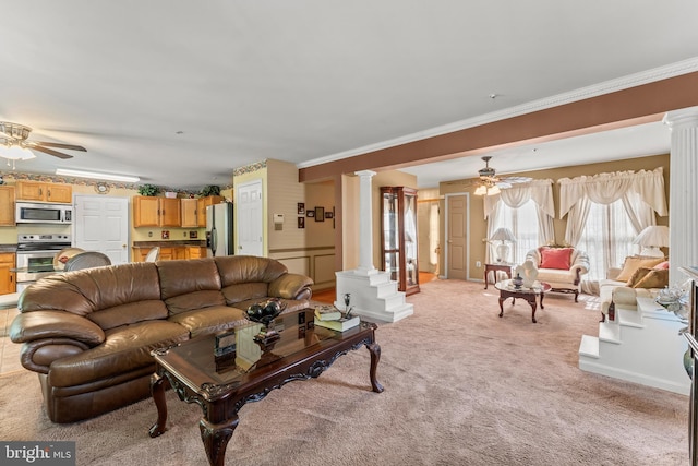 8910 Edison Ln, Clinton, MD 20735 - living room featuring decorative columns, ceiling fan, light colored carpet, and crown molding