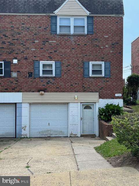 724 Susquehanna Rd, Philadelphia, PA 19111 - view of front of property with a garage, roof with shingles, and brick siding