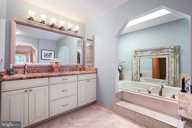 616 Silverstone Ct, Silver Spring, MD 20905 - bathroom featuring a tub with jets, double vanity, and marble finish flooring