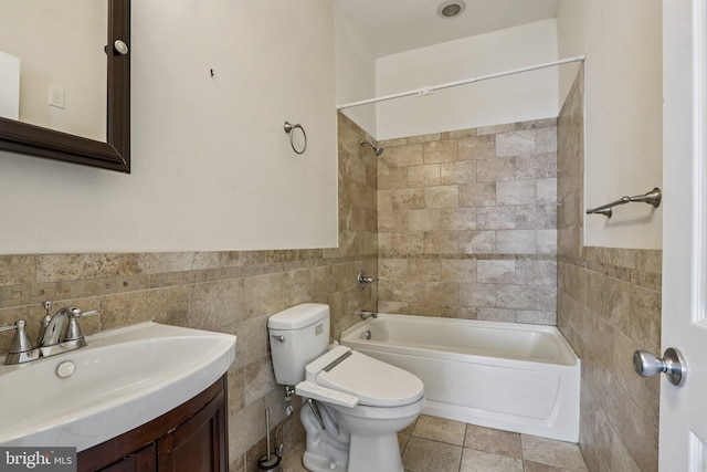 605 N 12th St Unit B, Philadelphia, PA 19123 - bathroom with tile walls, washtub / shower combination, vanity, a wainscoted wall, and tile patterned floors