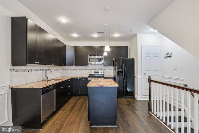 605 N 12th St Unit B, Philadelphia, PA 19123 - kitchen featuring appliances with stainless steel finishes, dark wood-style flooring, a center island, and backsplash
