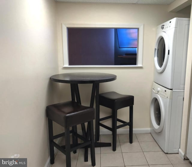 1708 Timbercreek, Clementon, NJ 08021 - washroom featuring stacked washer / dryer and light tile patterned flooring