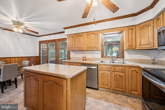 112 Tennessee Trl, Browns Mills, NJ 08015 - kitchen featuring appliances with stainless steel finishes, a ceiling fan, a center island, a wainscoted wall, and light countertops