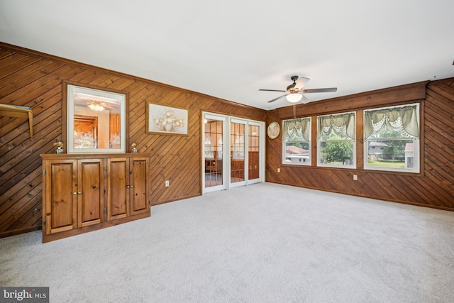 112 Tennessee Trl, Browns Mills, NJ 08015 - unfurnished room with a ceiling fan, wooden walls, and light colored carpet