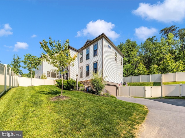 9929 Arapahoe Rd, New Market, MD 21774 - rear view of house featuring asphalt driveway and an attached garage