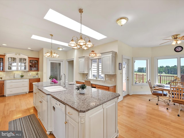 2768 Zink Rd, Manheim, PA 17545 - kitchen featuring a skylight, backsplash, light wood-type flooring, white dishwasher, and recessed lighting