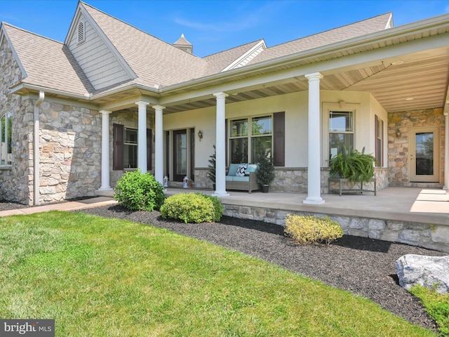 2768 Zink Rd, Manheim, PA 17545 - view of front of house featuring stone siding, roof with shingles, a front yard, an outdoor hangout area, and a porch