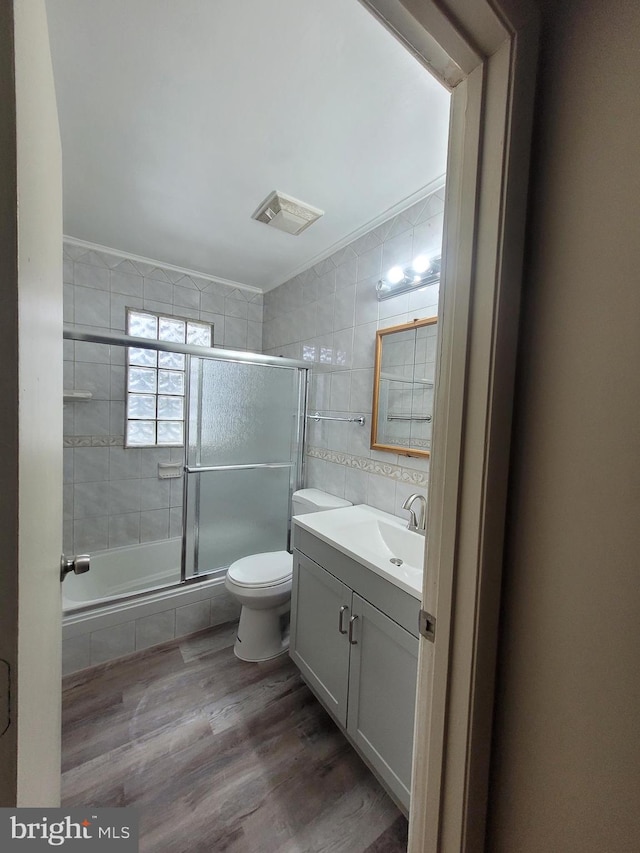 244 6th St, Colonial Beach, VA 22443 - full bath featuring tile walls, vanity, wood finished floors, and tiled shower / bath