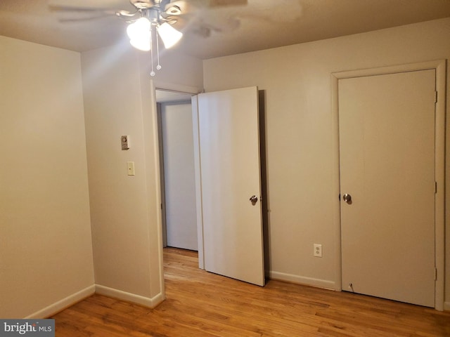 244 6th St, Colonial Beach, VA 22443 - unfurnished bedroom featuring light wood-style floors and ceiling fan