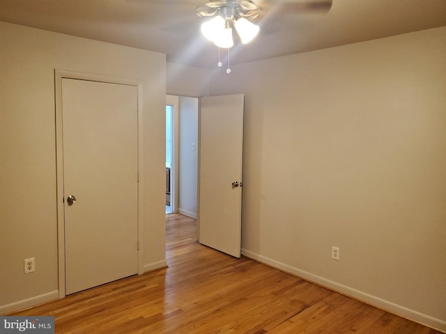 244 6th St, Colonial Beach, VA 22443 - unfurnished bedroom with light wood finished floors and ceiling fan