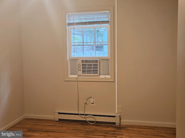 244 6th St, Colonial Beach, VA 22443 - spare room with baseboard heating and wood finished floors