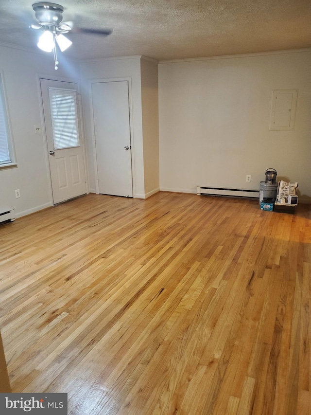 244 6th St, Colonial Beach, VA 22443 - unfurnished living room featuring light wood-style floors, ceiling fan, a baseboard radiator, a textured ceiling, and electric panel