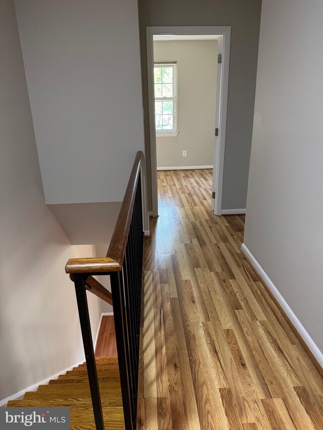11450 Fruitwood Way Unit 92, Germantown, MD 20876 - corridor featuring wood finished floors and an upstairs landing