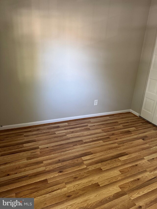 11450 Fruitwood Way Unit 92, Germantown, MD 20876 - spare room featuring wood finished floors and baseboards