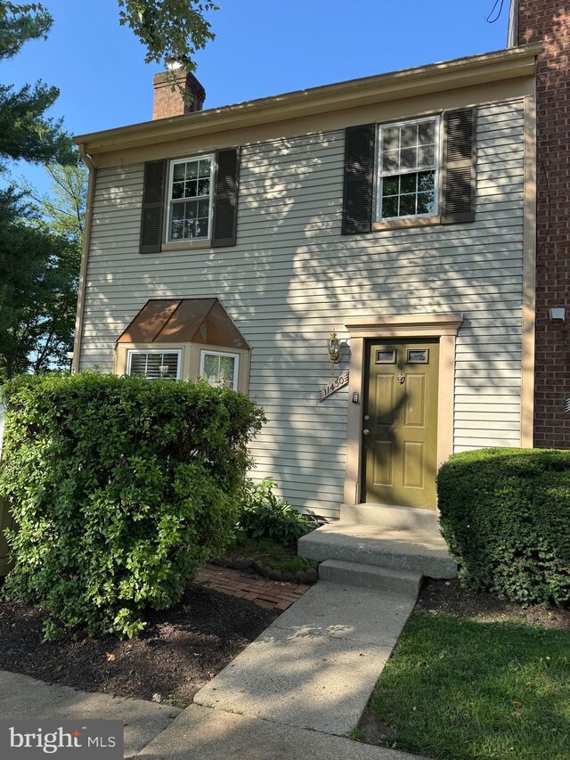 11450 Fruitwood Way Unit 92, Germantown, MD 20876 - view of front facade featuring a chimney