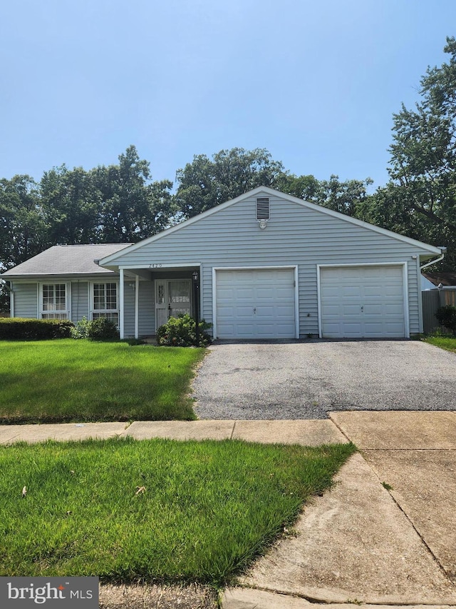 2420 Mary Pl, Fort Washington, MD 20744 - single story home with a front yard, asphalt driveway, and a garage